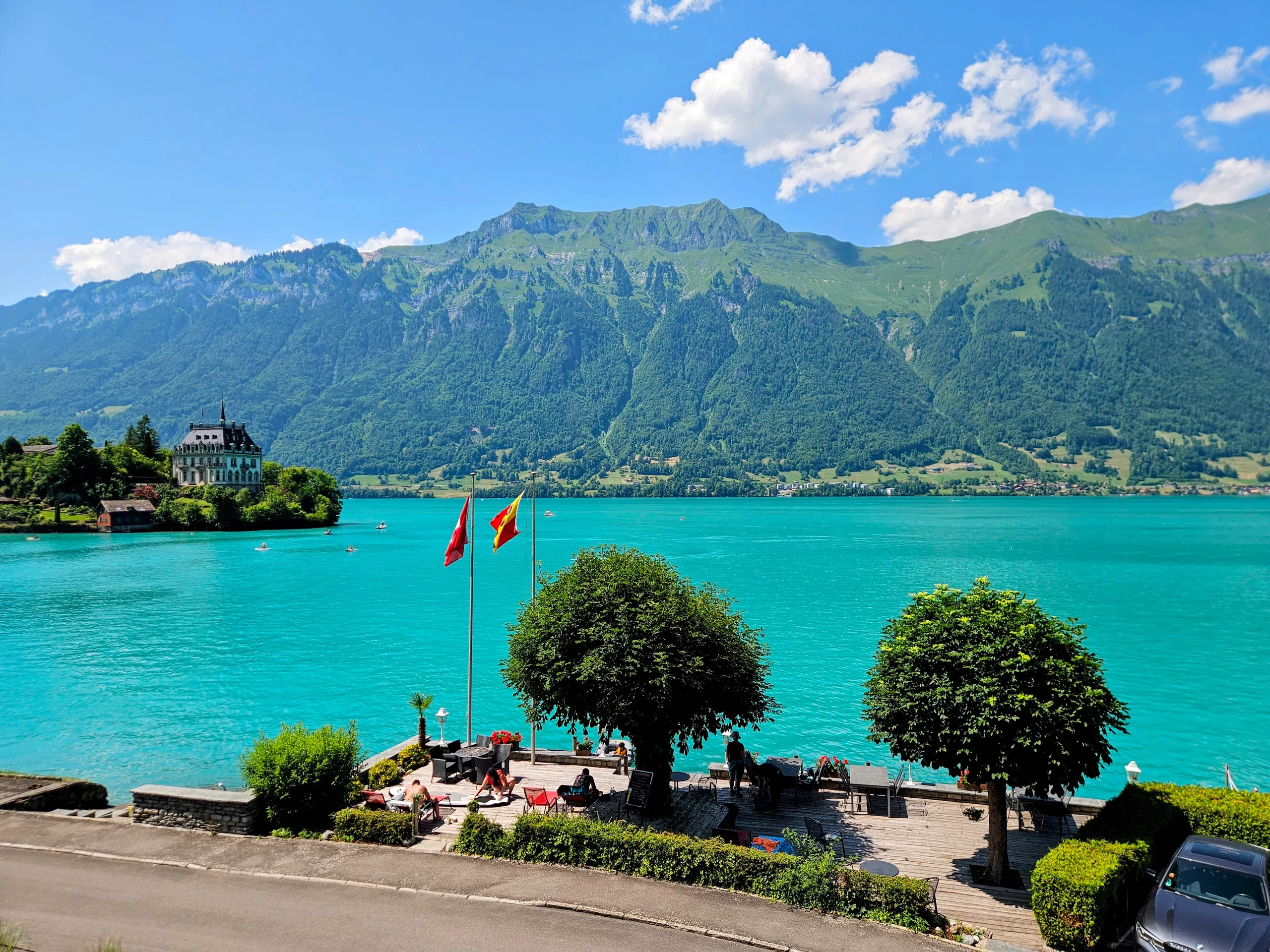 Boutique Hotel Bellevue Iseltwald balcony view over the turquoise waters of Lake Brienz